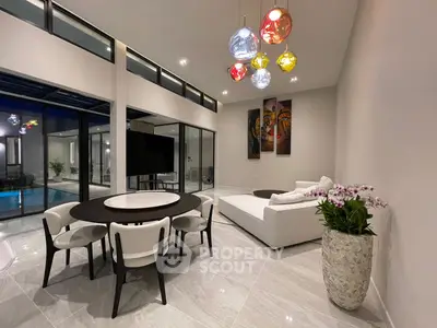 Luxurious modern living room with high ceilings, elegant dining set, and pool view, perfect for entertaining.