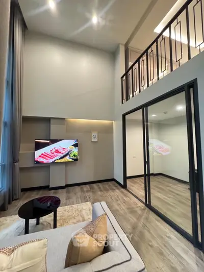 Modern duplex living room with high ceilings and elegant decor