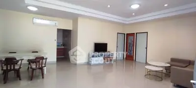 Spacious living room with modern furniture and open layout, perfect for family gatherings.