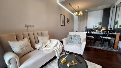 Stylish living room with elegant furniture and modern decor in a cozy apartment setting.