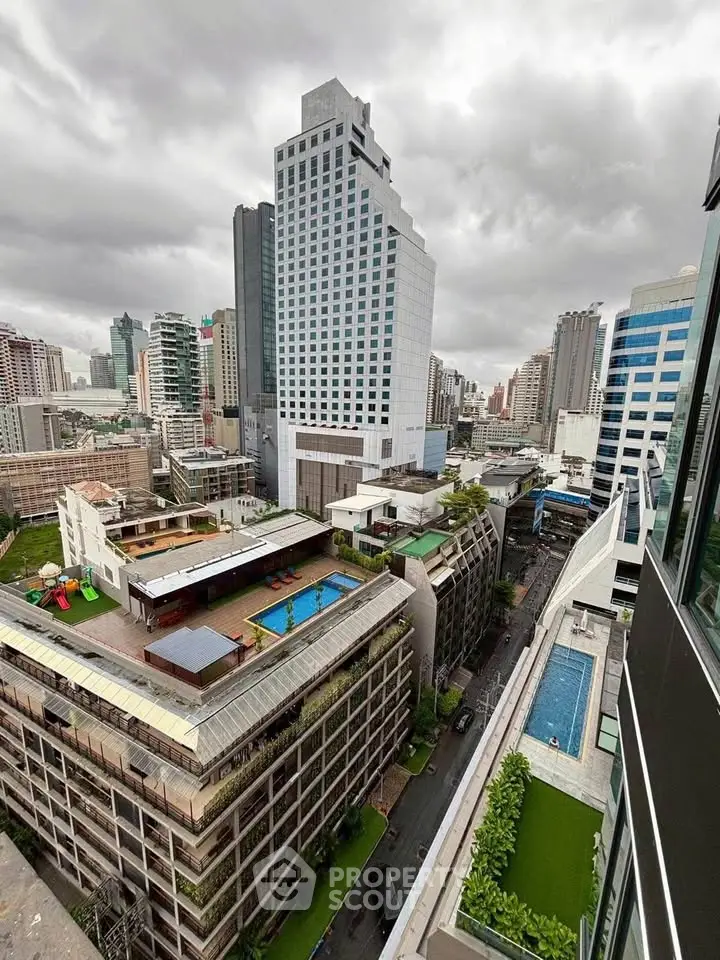 Stunning cityscape view with modern high-rise buildings and rooftop pools.