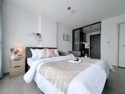 Modern bedroom with cozy decor and elegant furnishings in a stylish apartment.