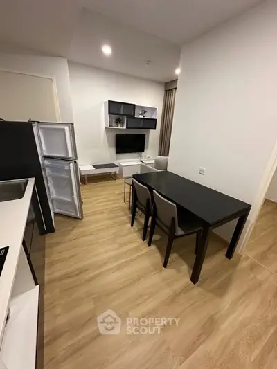 Modern living room with open kitchen and sleek furniture design