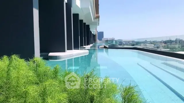 Luxurious rooftop infinity pool with stunning city views and modern architecture.