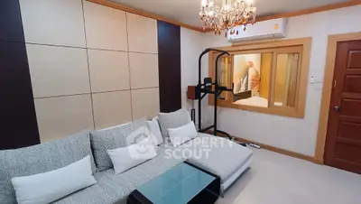 Luxurious living room with modern decor and elegant chandelier