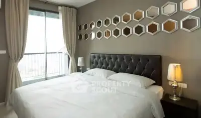 Modern bedroom with stylish decor and large window balcony access