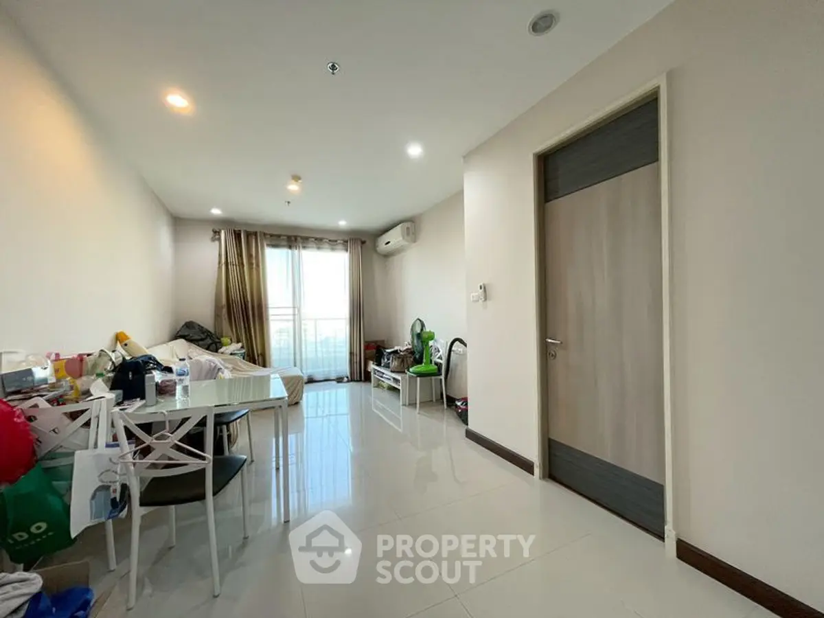 Spacious living room with modern decor and natural light