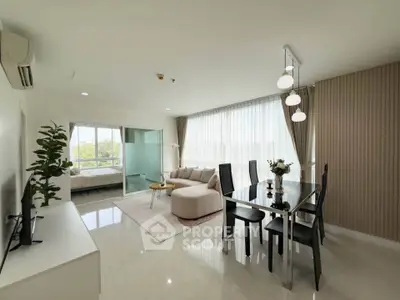Spacious modern living room with dining area and natural light