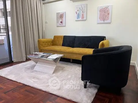 Stylish living room with modern decor and cozy seating area.