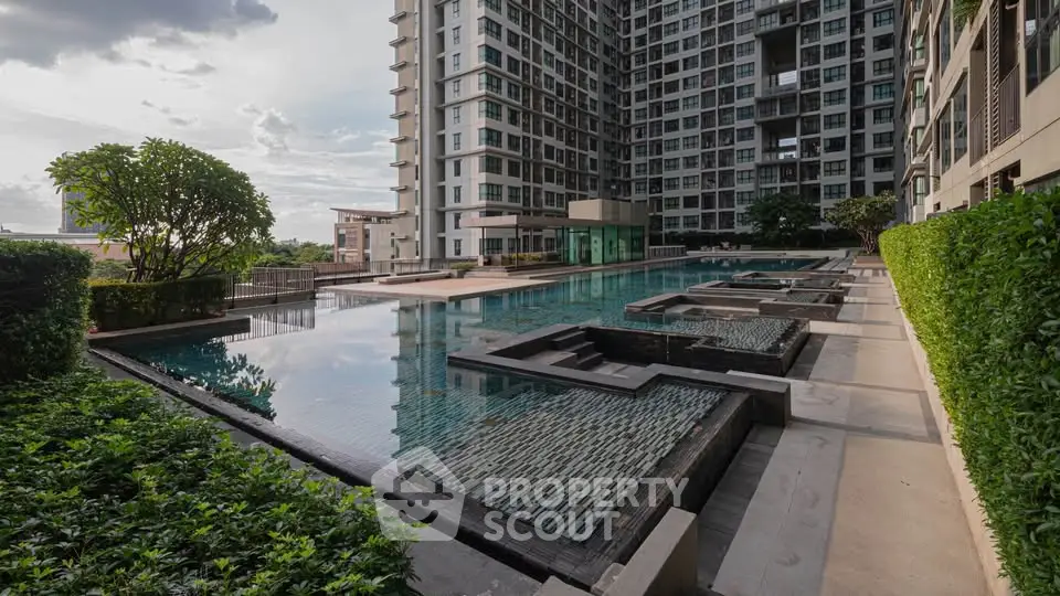 Luxurious condominium with stunning pool and modern architecture, perfect for urban living.