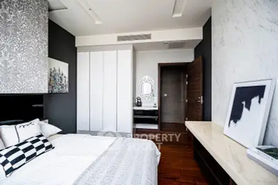 Modern bedroom with stylish decor and ample storage space
