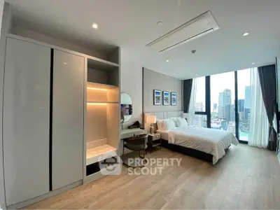 Luxurious bedroom with city view, modern decor, and ample natural light