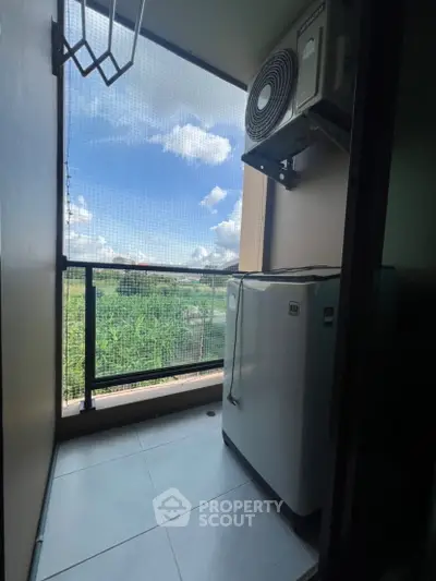 Compact balcony with outdoor appliance and scenic view