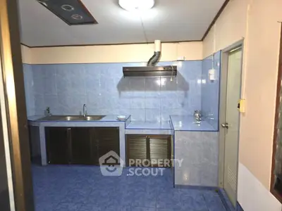 Spacious kitchen with dual sinks and ample counter space in modern home