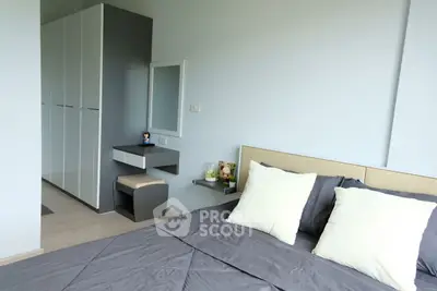 Modern bedroom with sleek wardrobe and cozy bedding