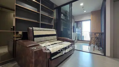 Modern living room with leather sofa and open balcony view