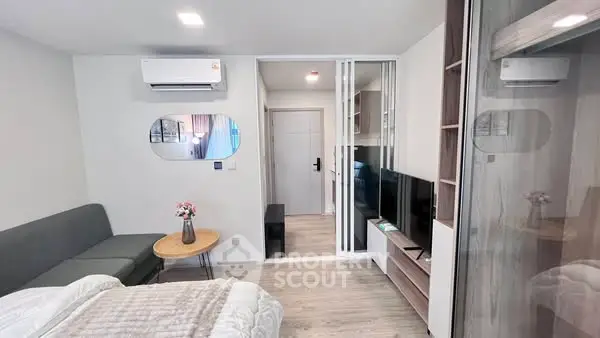Modern studio apartment with sleek design and cozy furnishings