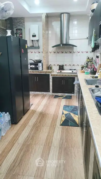 Modern kitchen with sleek cabinets and stainless steel appliances