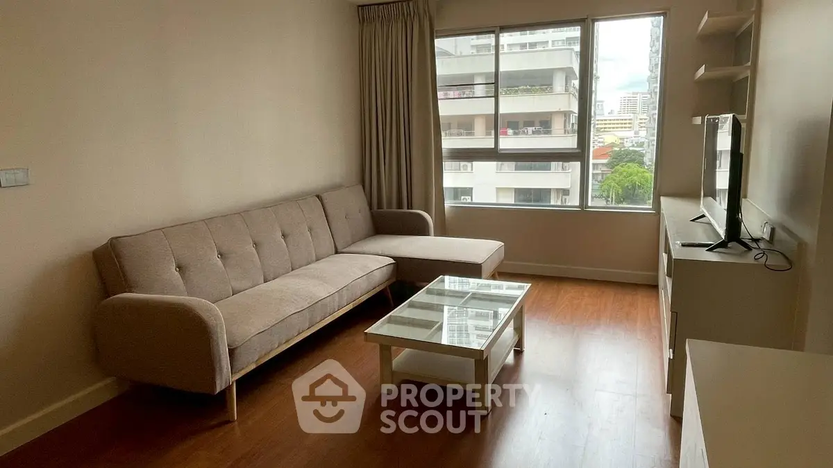 Cozy living room with modern sofa and city view window