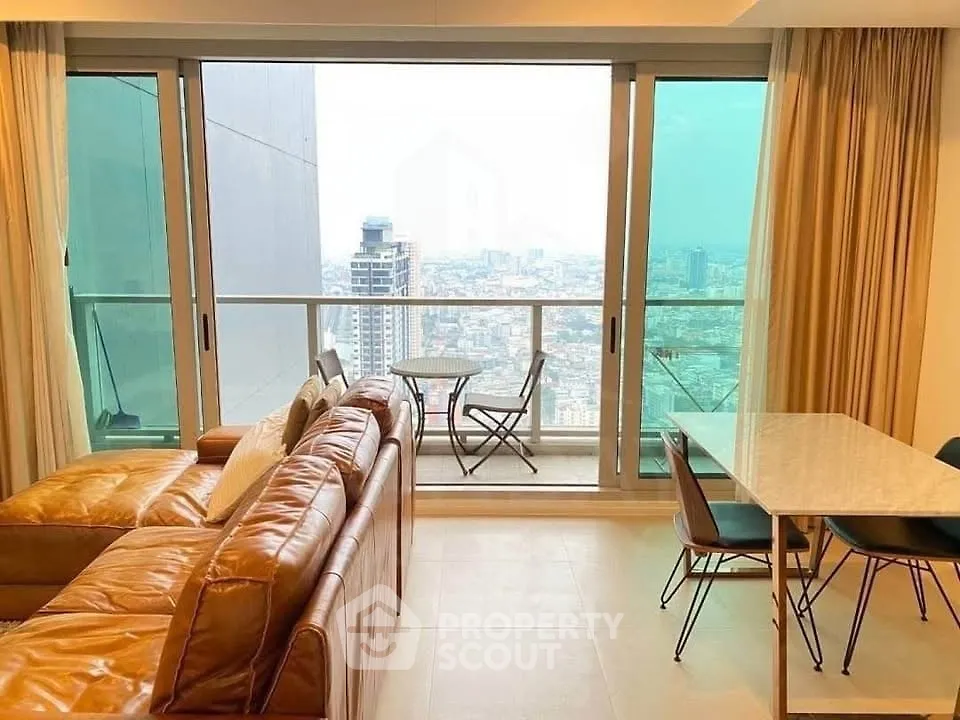 Modern living room with city view and balcony in high-rise apartment