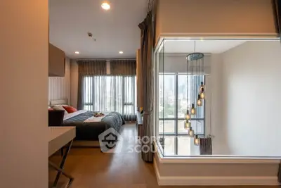 Modern bedroom with large windows and city view, featuring elegant lighting and stylish decor.