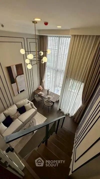 Luxurious modern living room with high ceilings and elegant decor