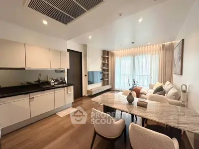 Modern open-layout living room with sleek kitchen and elegant dining area, featuring contemporary furniture and ample natural light.