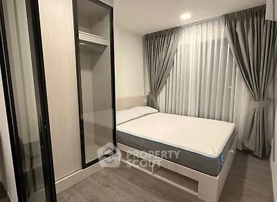 Modern bedroom with sleek wardrobe and cozy bed in stylish apartment.