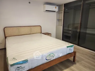 Modern bedroom with new mattress and built-in wardrobe