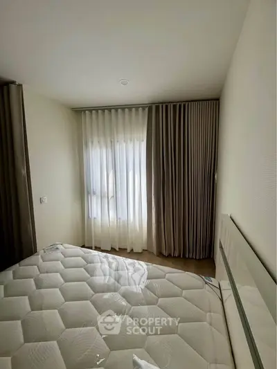 Cozy bedroom with modern design and ample natural light