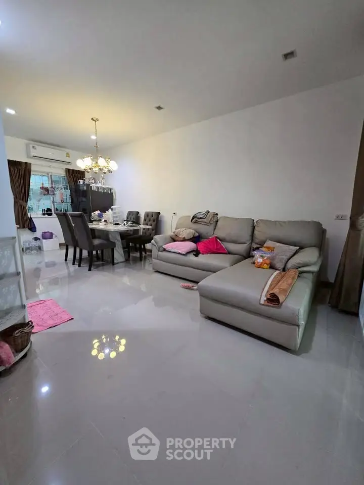 Spacious living room with modern furniture and elegant dining area