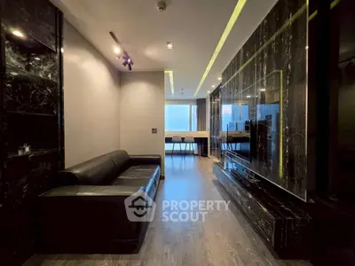 Luxurious modern living room with sleek black marble accents and elegant lighting