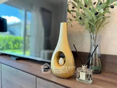 Stylish living room decor with modern TV and elegant accessories