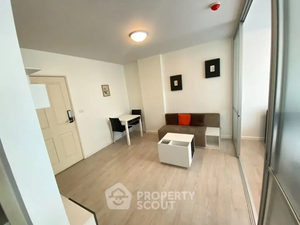 Modern living room with sleek furniture and wooden flooring