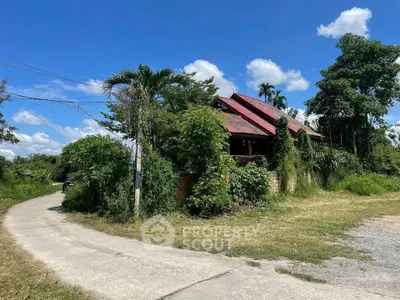 Charming rustic house surrounded by lush greenery on a sunny day