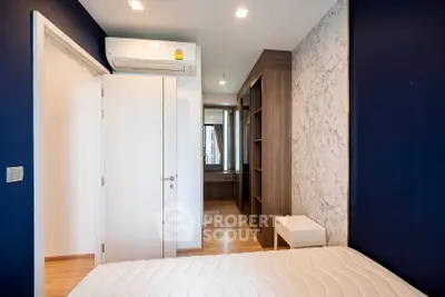 Modern bedroom with stylish decor and built-in closet