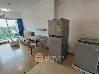 Modern living room with balcony, dining area, fridge, and washing machine.