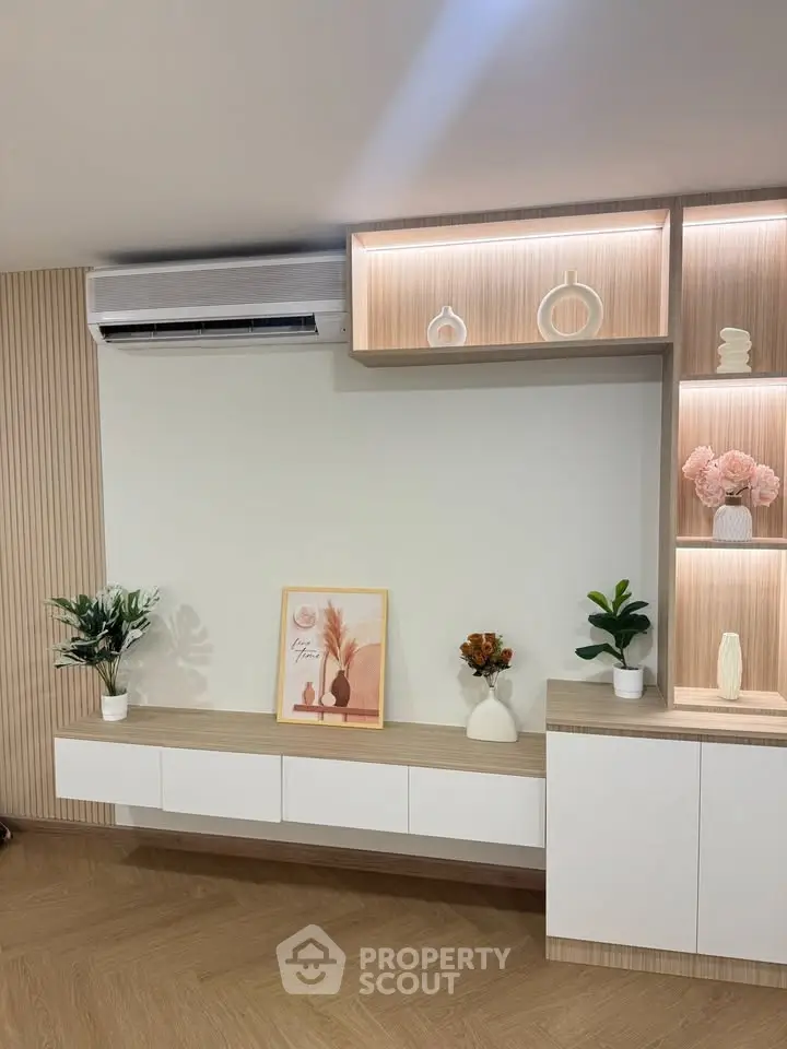 Modern living room with elegant shelving and air conditioning unit