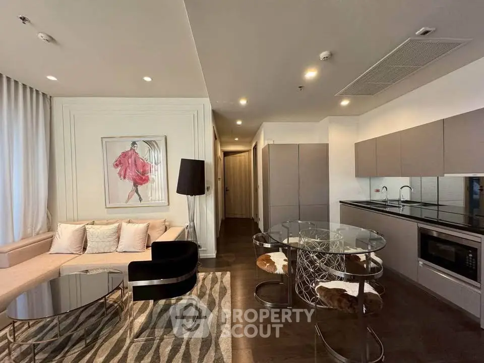 Modern open-layout living room with stylish kitchen and elegant decor