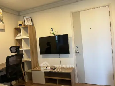 Modern study room with wall-mounted TV and sleek furniture