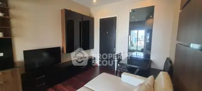 Modern living room with sleek furniture and city view, perfect for urban living.