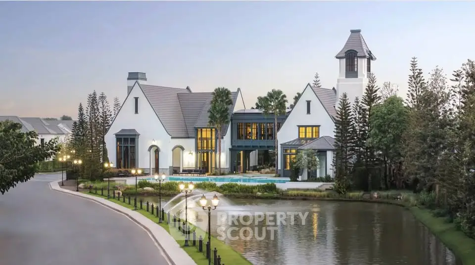 Stunning luxury estate with elegant architecture and serene pond view, perfect for upscale living.