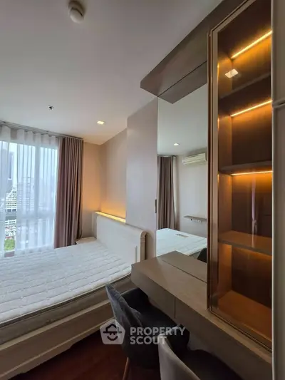 Modern bedroom with city view, featuring a stylish bed, elegant curtains, and a sleek wooden desk with chair.