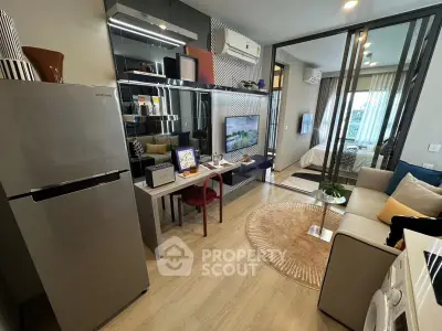 Modern apartment interior with open layout, featuring stylish living room and kitchen area.