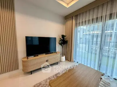 Modern living room with stylish TV stand and large window view