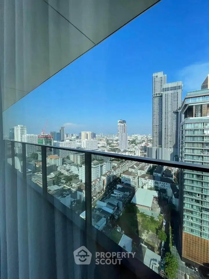 Stunning cityscape view from a modern high-rise balcony, showcasing urban living at its finest.