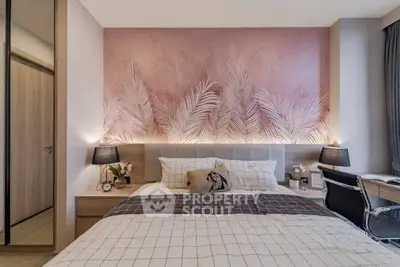 Stylish bedroom with modern decor and elegant lighting, featuring a cozy bed and workspace.
