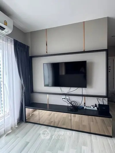 Modern living room with sleek TV setup and stylish decor