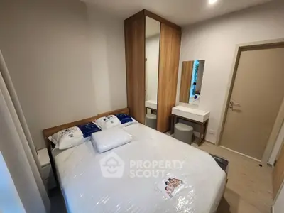 Cozy bedroom with modern furniture and ample storage space