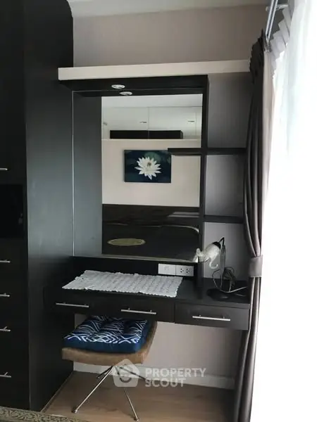 Stylish bedroom corner with modern vanity and elegant decor